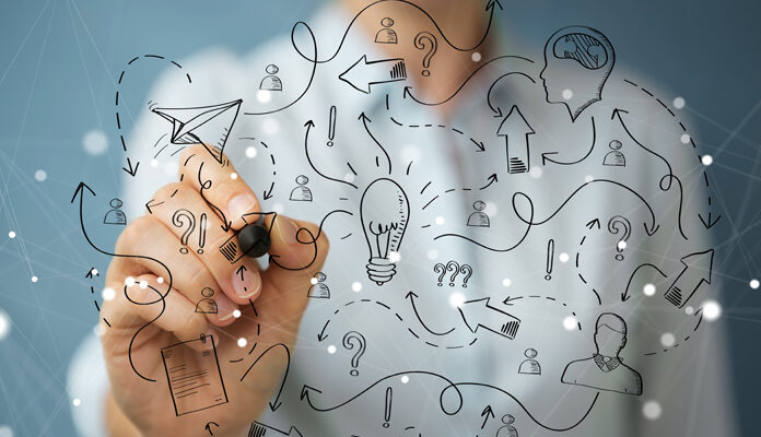 Iemand maakt ingewikkelde tekening op glas