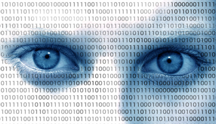 Twee blauwe ogen die je aankijken met daaroverheen nullen en enen