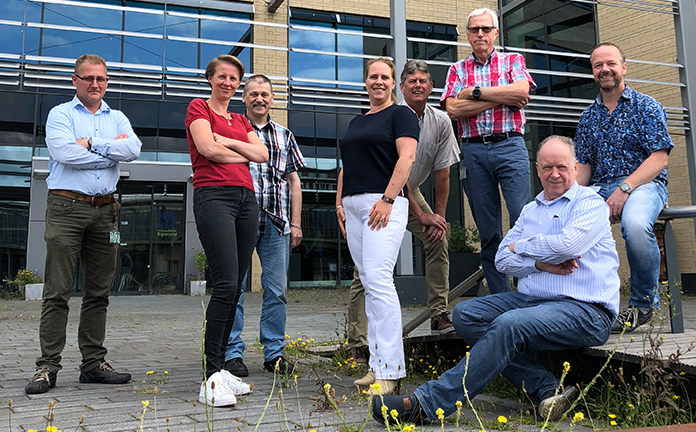 Medewerkers van DCMR op groepsfoto