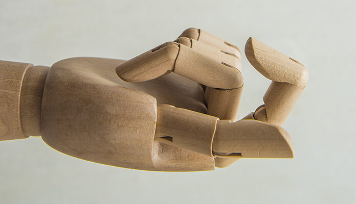 Houten hand met lokkende vinger