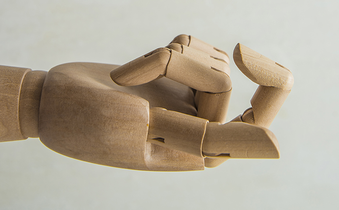 Houten hand met lokkende vinger