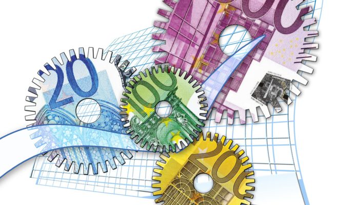 Vier tandwielen met briefgeld