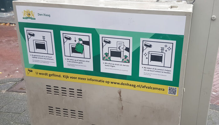 Afbeelding van container met tekst dat er camera's zijn geplaatst