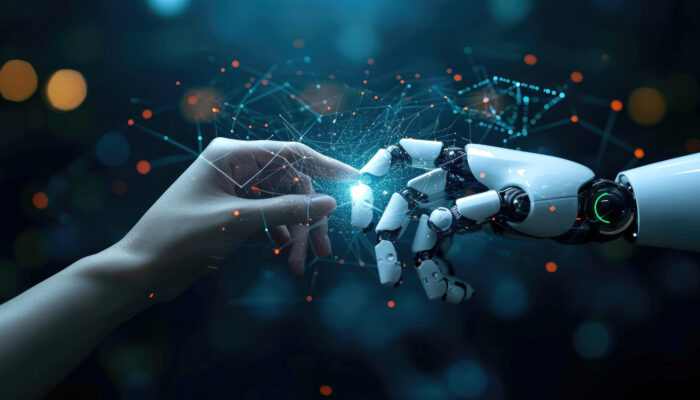 Hand van mens raakt hand van robot aan